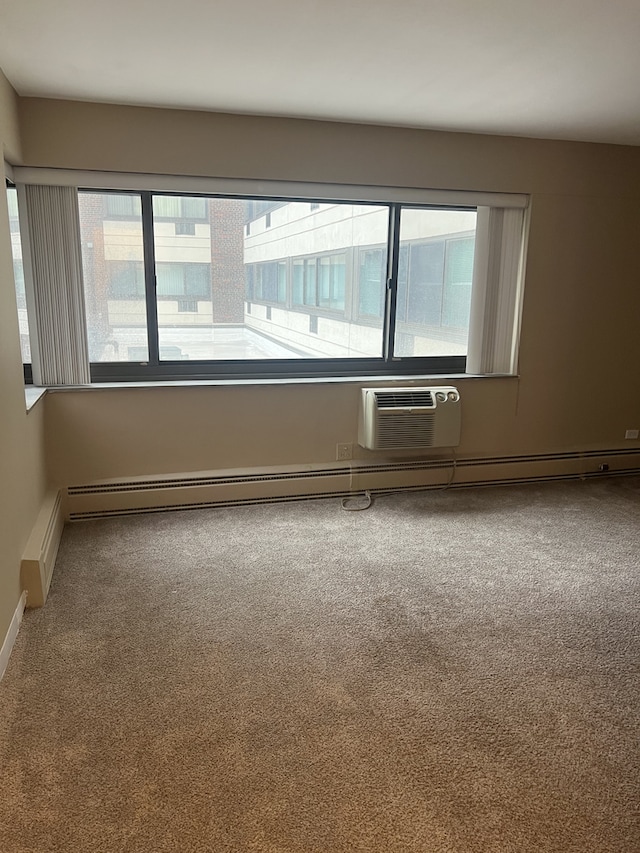 7337 S S Shore Dr Unit 216, Chicago, IL 60649 - spare room with carpet floors, plenty of natural light, a wall unit AC, and baseboards
