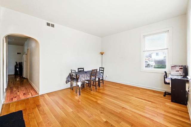 1738 N Latrobe Ave, Chicago, IL 60639 - office space with arched walkways, light wood-style flooring, and baseboards