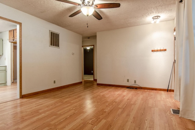 378 E Union St, Seneca, IL 61360 - unfurnished room with a textured ceiling, ceiling fan, and light wood-type flooring