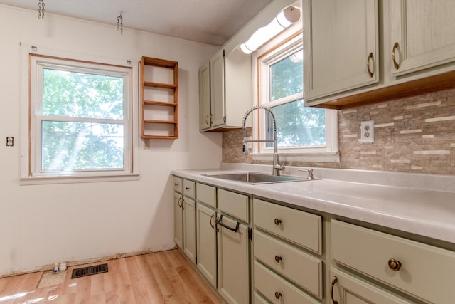 378 E Union St, Seneca, IL 61360 - kitchen with decorative backsplash, plenty of natural light, and light wood-style floors