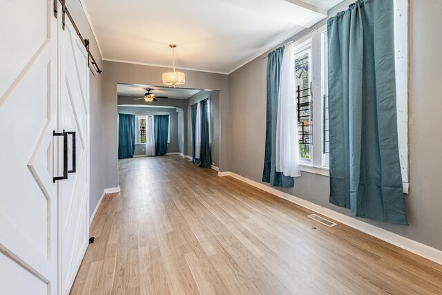 7115 S Rockwell St, Chicago, IL 60629 - spare room featuring plenty of natural light, light wood-type flooring, baseboards, crown molding, and ceiling fan