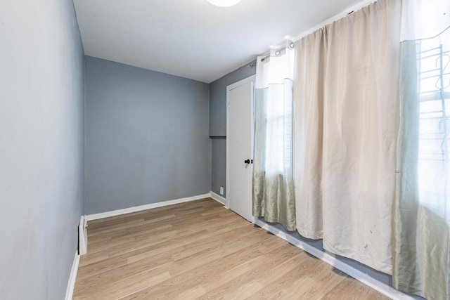 7115 S Rockwell St, Chicago, IL 60629 - spare room featuring light wood-style flooring and baseboards