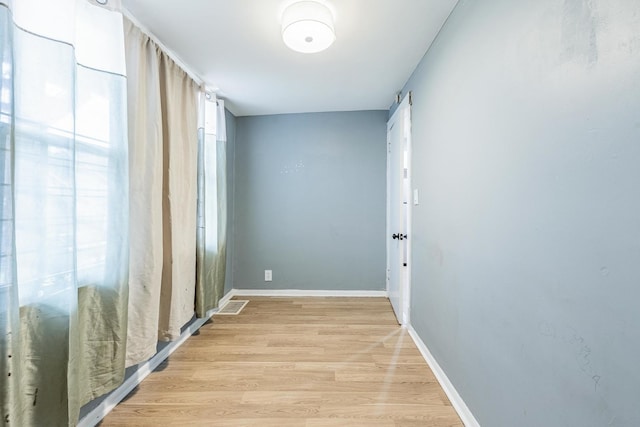 7115 S Rockwell St, Chicago, IL 60629 - empty room with light wood-style flooring and baseboards
