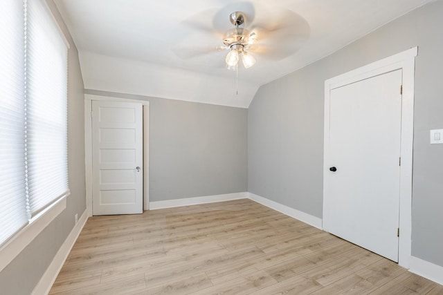 7115 S Rockwell St, Chicago, IL 60629 - unfurnished room with a ceiling fan, vaulted ceiling, healthy amount of natural light, light wood-style flooring, and baseboards