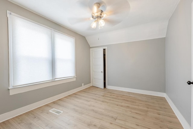 7115 S Rockwell St, Chicago, IL 60629 - spare room featuring vaulted ceiling, a ceiling fan, light wood-type flooring, and baseboards
