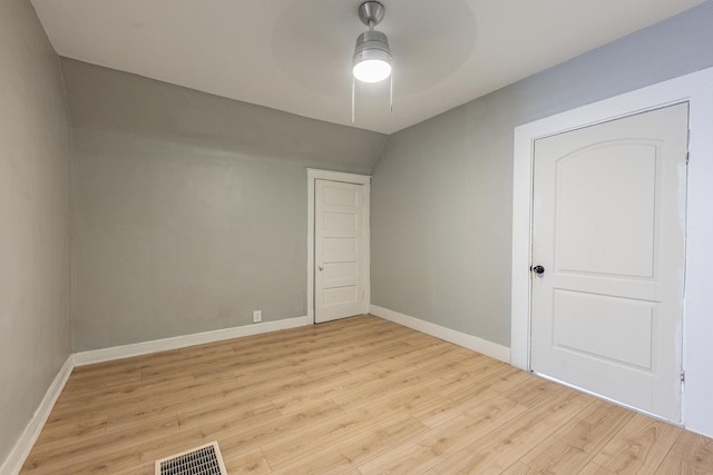 7115 S Rockwell St, Chicago, IL 60629 - unfurnished bedroom featuring light wood-style floors, baseboards, and a ceiling fan