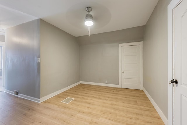 7115 S Rockwell St, Chicago, IL 60629 - unfurnished room featuring a ceiling fan, light wood-style floors, and baseboards