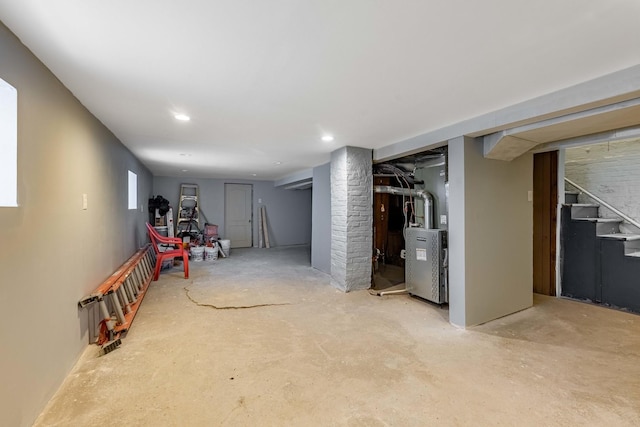 7115 S Rockwell St, Chicago, IL 60629 - below grade area featuring heating unit, stairs, and recessed lighting