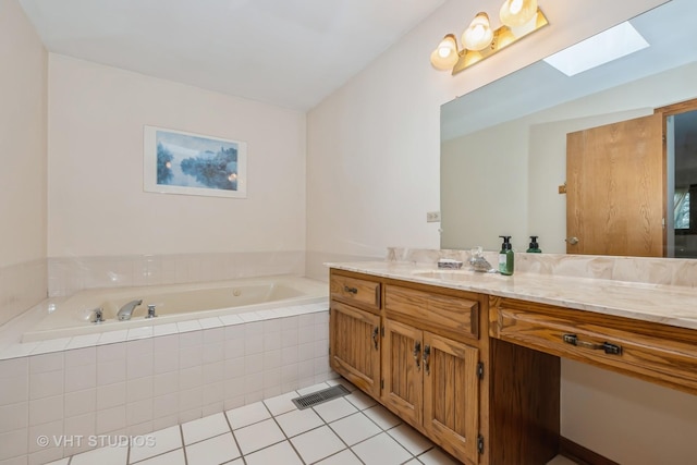 735 Vermont Rd, Frankfort, IL 60423 - bathroom featuring a skylight, vanity, a garden tub, and tile patterned floors