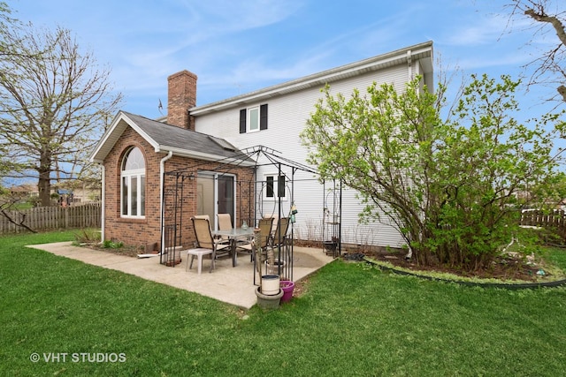 735 Vermont Rd, Frankfort, IL 60423 - rear view of house featuring a chimney, brick siding, and a patio area
