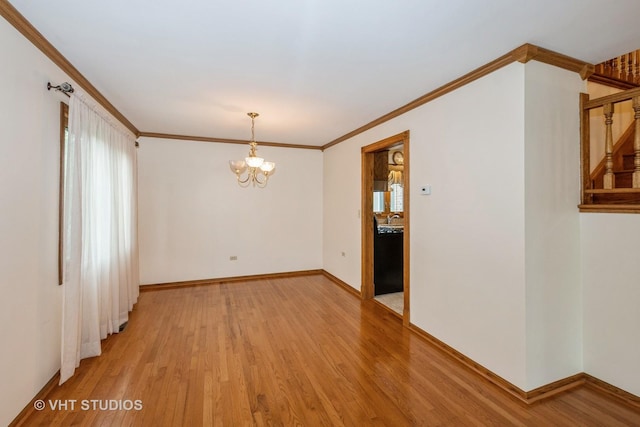 735 Vermont Rd, Frankfort, IL 60423 - spare room featuring light wood finished floors, a chandelier, ornamental molding, and baseboards
