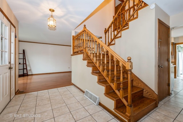 735 Vermont Rd, Frankfort, IL 60423 - stairs featuring tile patterned flooring, plenty of natural light, and baseboards