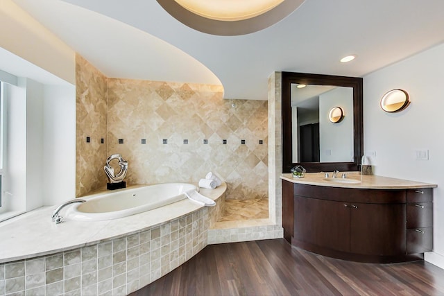 800 N Michigan Ave Unit 4801, Chicago, IL 60611 - bathroom with a bath, vanity, wood finished floors, and a tile shower
