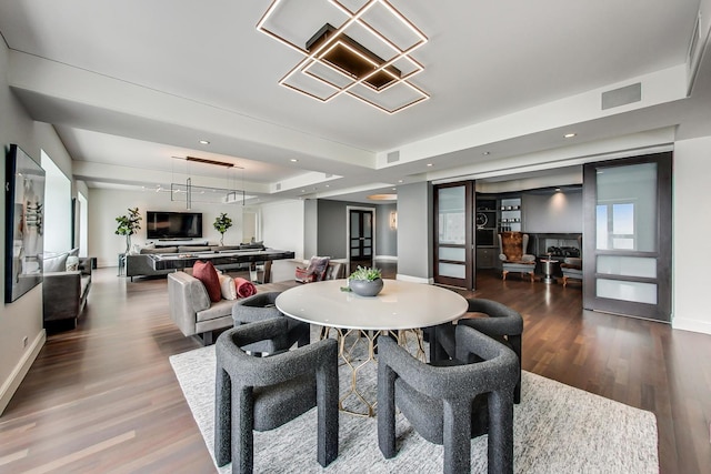 800 N Michigan Ave Unit 4801, Chicago, IL 60611 - dining area featuring wood finished floors, baseboards, and a chandelier