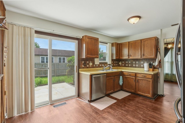 143 Hesterman Dr, Glendale Heights, IL 60139 - kitchen featuring dishwasher, light countertops, and decorative backsplash