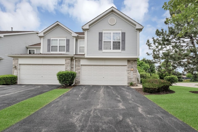 2422 Georgetown Cir, Aurora, IL 60503 - view of front facade featuring stone siding, driveway, an attached garage, and a front yard