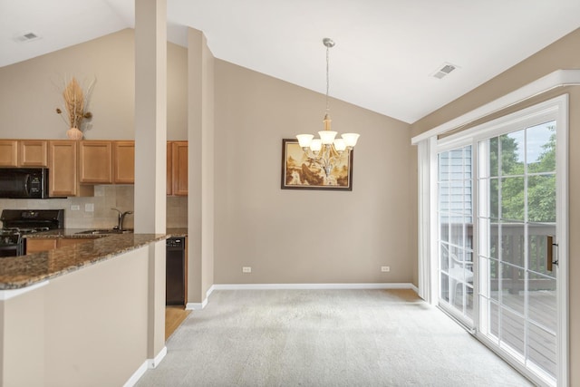 2422 Georgetown Cir, Aurora, IL 60503 - kitchen featuring black appliances, lofted ceiling, baseboards, and light carpet