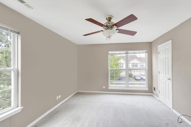 2422 Georgetown Cir, Aurora, IL 60503 - unfurnished room with baseboards, light colored carpet, and ceiling fan