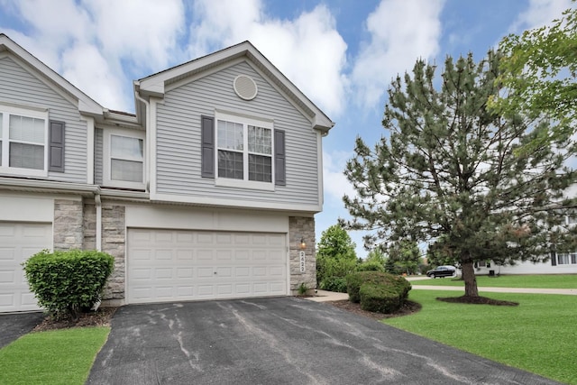 2422 Georgetown Cir, Aurora, IL 60503 - view of front of property featuring stone siding, a garage, asphalt driveway, and a front lawn