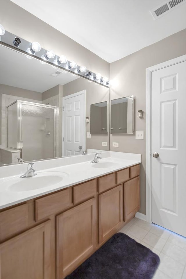 2422 Georgetown Cir, Aurora, IL 60503 - full bath with double vanity, a stall shower, and tile patterned floors