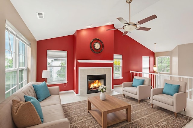 2422 Georgetown Cir, Aurora, IL 60503 - living room with plenty of natural light, a ceiling fan, a tile fireplace, and high vaulted ceiling