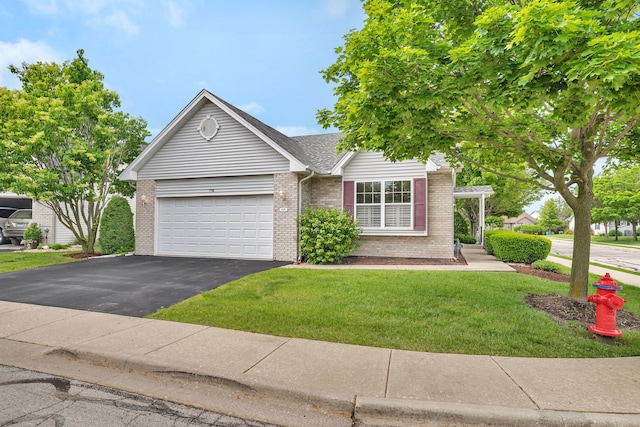 1039 Stewart Ct, Joliet, IL 60431 - view of front of house featuring brick siding, driveway, a garage, and a front lawn