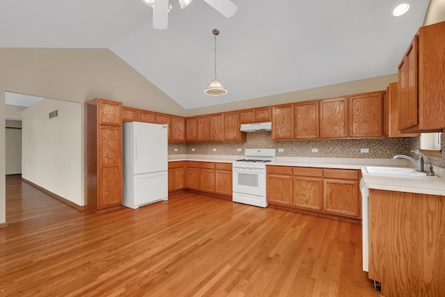 1039 Stewart Ct, Joliet, IL 60431 - kitchen featuring white appliances, under cabinet range hood, a sink, vaulted ceiling, and a ceiling fan