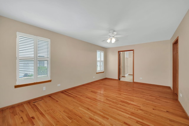 1039 Stewart Ct, Joliet, IL 60431 - spare room with a ceiling fan, light wood finished floors, and baseboards