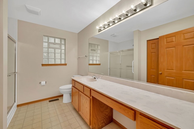 1039 Stewart Ct, Joliet, IL 60431 - full bathroom featuring a stall shower, vanity, toilet, and baseboards