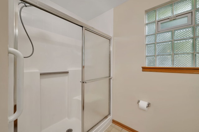 1039 Stewart Ct, Joliet, IL 60431 - bathroom featuring an enclosed shower and baseboards