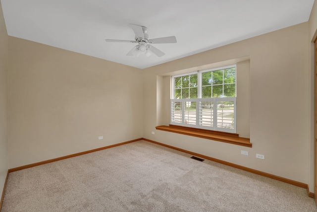 1039 Stewart Ct, Joliet, IL 60431 - spare room featuring baseboards, carpet, and ceiling fan