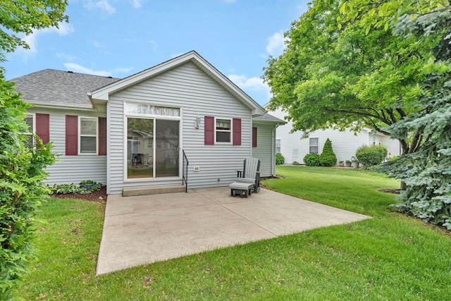 1039 Stewart Ct, Joliet, IL 60431 - back of property featuring a lawn, a patio, and a shingled roof