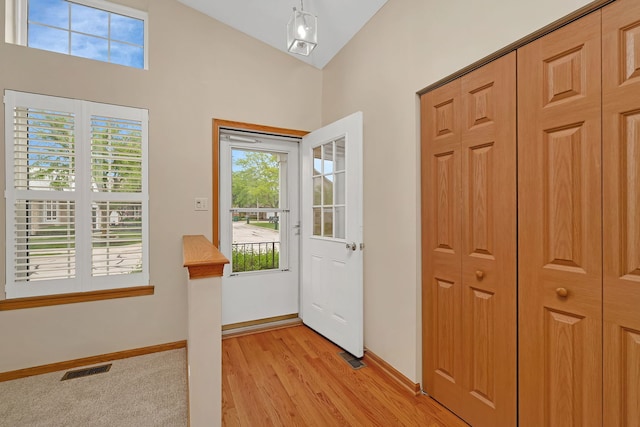 1039 Stewart Ct, Joliet, IL 60431 - entryway with light wood finished floors, baseboards, and high vaulted ceiling
