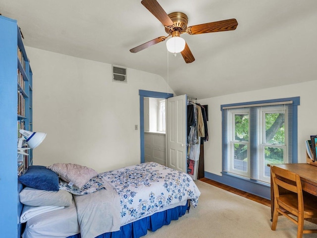 611 S Lynn St, Champaign, IL 61820 - bedroom with lofted ceiling, light wood-style floors, and ceiling fan