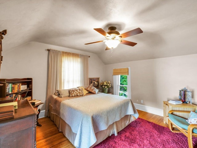 611 S Lynn St, Champaign, IL 61820 - bedroom with lofted ceiling, wood finished floors, baseboards, and ceiling fan