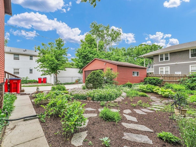 611 S Lynn St, Champaign, IL 61820 - view of yard featuring an outdoor structure and a detached garage