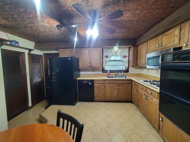3771 Emerald Ave, Steger, IL 60475 - kitchen with black appliances, a warming drawer, brown cabinets, light countertops, and a sink