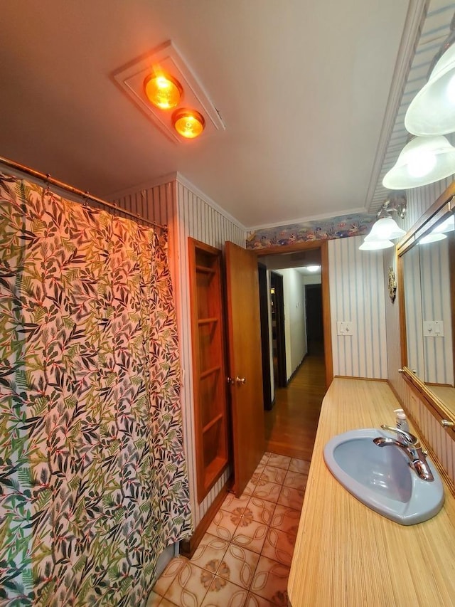 3771 Emerald Ave, Steger, IL 60475 - full bath featuring wallpapered walls, crown molding, tile patterned floors, vanity, and a shower with curtain