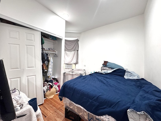 3316 W Flournoy St, Chicago, IL 60624 - bedroom featuring wood finished floors, a closet, and cooling unit