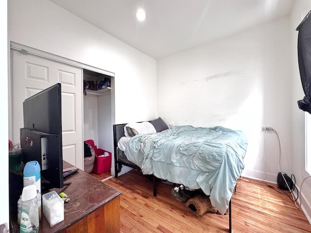 3316 W Flournoy St, Chicago, IL 60624 - bedroom with light wood finished floors, a closet, and recessed lighting