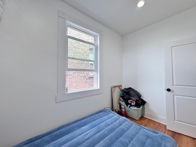 3316 W Flournoy St, Chicago, IL 60624 - bedroom with wood finished floors, baseboards, and recessed lighting