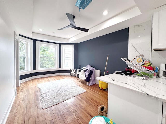 3316 W Flournoy St, Chicago, IL 60624 - game room with a raised ceiling, light wood finished floors, baseboards, a ceiling fan, and recessed lighting