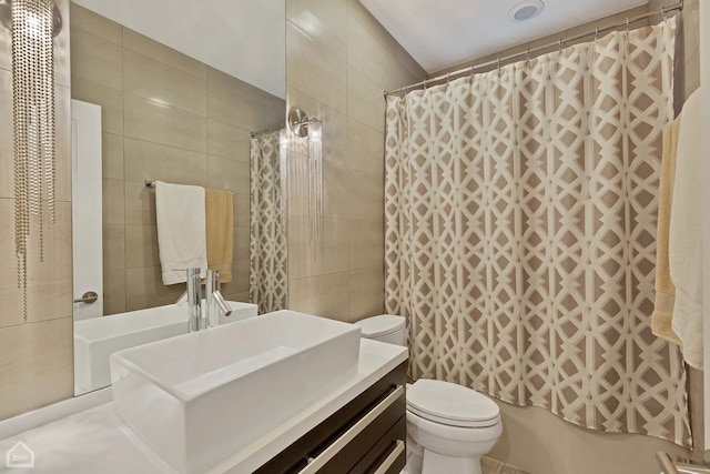 1807 W Ohio St, Chicago, IL 60622 - full bathroom featuring tile walls, vanity, toilet, and curtained shower
