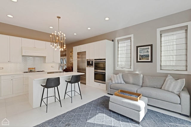 1807 W Ohio St, Chicago, IL 60622 - living room featuring a chandelier and recessed lighting