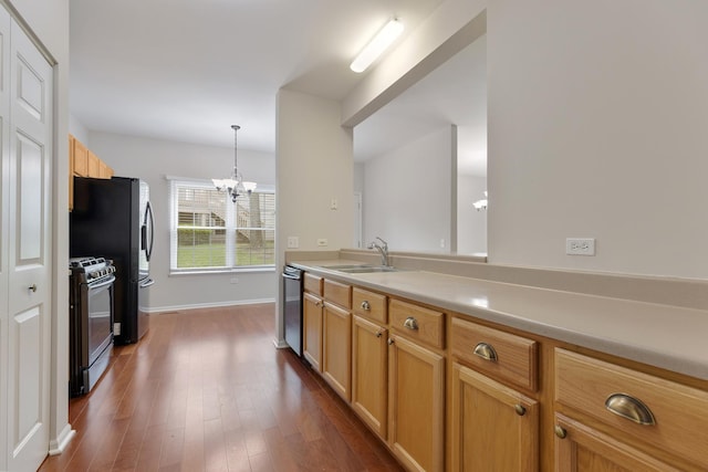 5261 Pebble Ln, Crystal Lake, IL 60012 - kitchen with range with gas stovetop, a sink, a chandelier, dishwasher, and light countertops