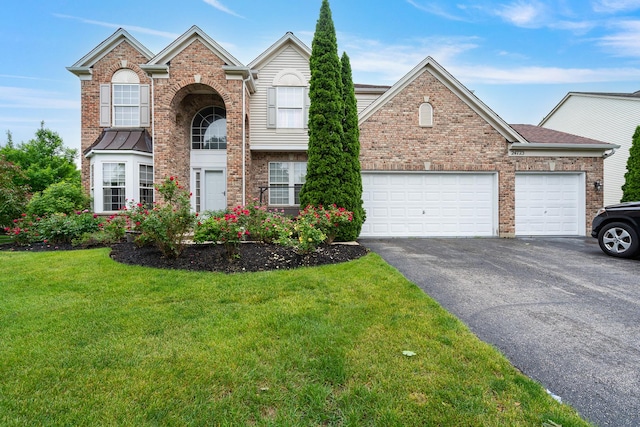 24723 W Champion Dr, Plainfield, IL 60585 - traditional home with driveway, brick siding, a front yard, and an attached garage