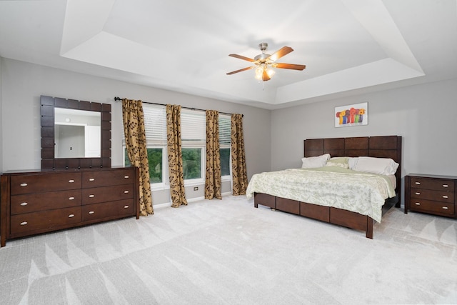24723 W Champion Dr, Plainfield, IL 60585 - bedroom featuring a raised ceiling, light colored carpet, and ceiling fan