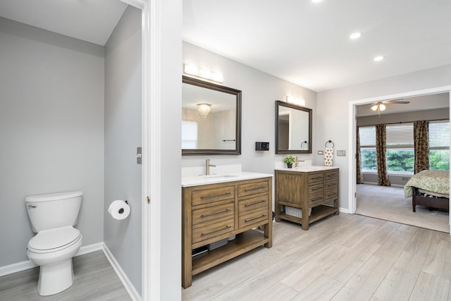 24723 W Champion Dr, Plainfield, IL 60585 - full bathroom with two vanities, wood finished floors, baseboards, connected bathroom, and recessed lighting