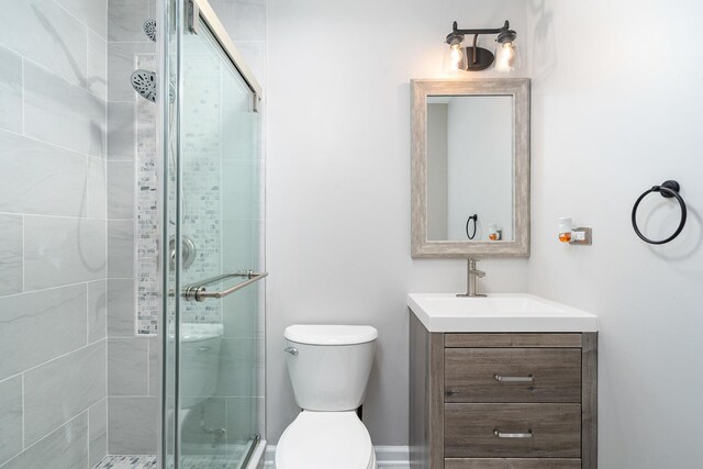 24723 W Champion Dr, Plainfield, IL 60585 - bathroom featuring a shower stall, vanity, and toilet
