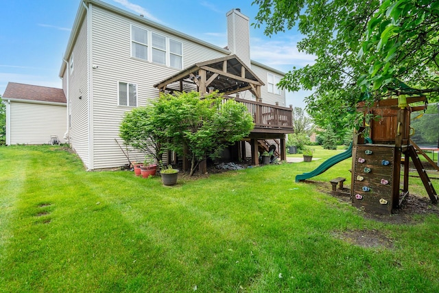 24723 W Champion Dr, Plainfield, IL 60585 - rear view of property featuring a playground, a wooden deck, a lawn, and a chimney
